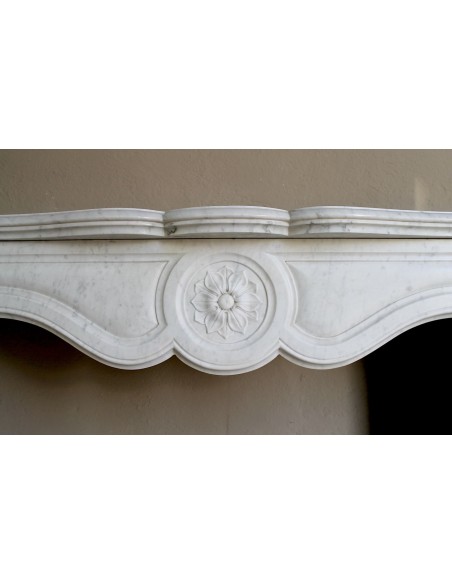 Antique fireplace mantel in Pure White marble, Baroque style, with floral motifs, offered at a discounted price.