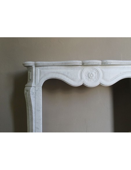 Antique fireplace mantel in Pure White marble, Baroque style, with floral motifs, offered at a discounted price.