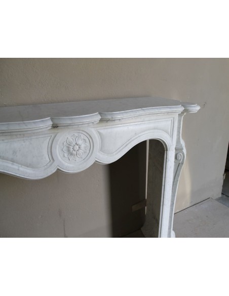 Antique fireplace mantel in Pure White marble, Baroque style, with floral motifs, offered at a discounted price.