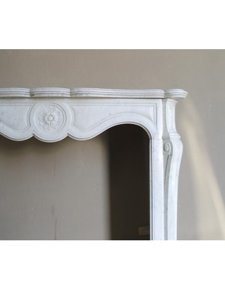 Antique fireplace mantel in Pure White marble, Baroque style, with floral motifs, offered at a discounted price.