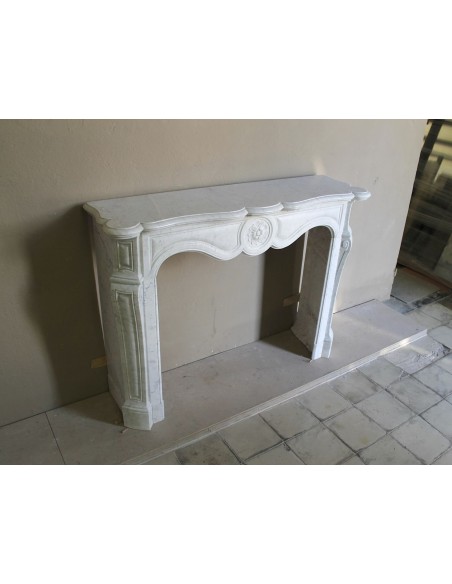 Antique fireplace mantel in Pure White marble, Baroque style, with floral motifs, offered at a discounted price.