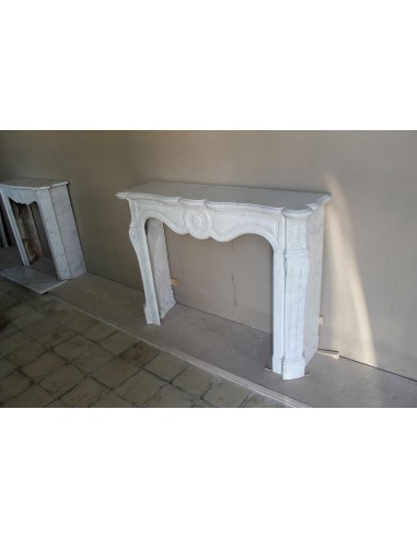 Antique fireplace mantel in Pure White marble, Baroque style, with floral motifs, offered at a discounted price.