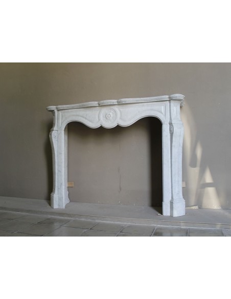 Antique fireplace mantel in Pure White marble, Baroque style, with floral motifs, offered at a discounted price.