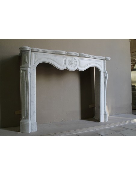 Antique fireplace mantel in Pure White marble, Baroque style, with floral motifs, offered at a discounted price.
