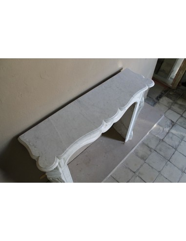 Antique fireplace mantel in Pure White marble, Baroque style, with floral motifs, offered at a discounted price.