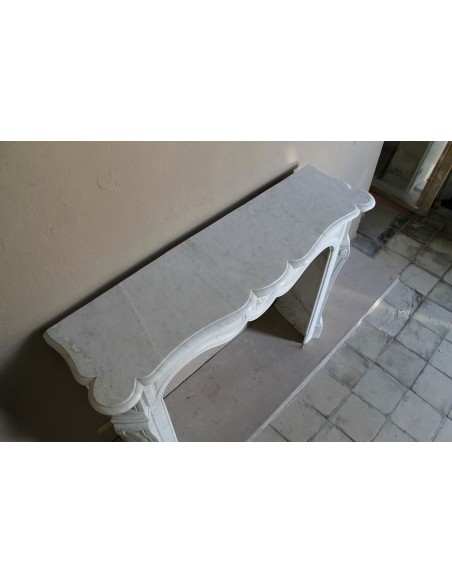 Antique fireplace mantel in Pure White marble, Baroque style, with floral motifs, offered at a discounted price.