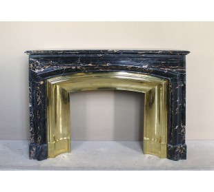 Antique Louis XIV "Boudin" fireplace mantel in exceptional black Portoro marble, complete with its original gilt brass insert.