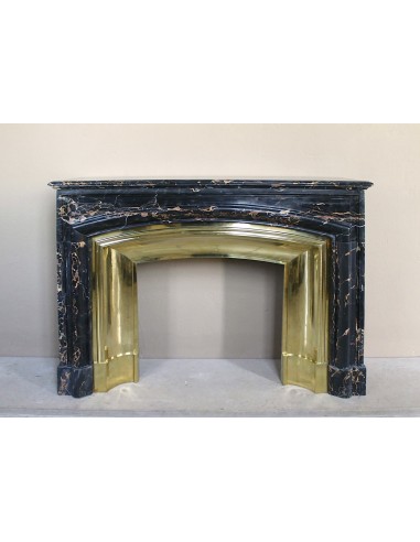 Antique Louis XIV "Boudin" fireplace mantel in exceptional black Portoro marble, complete with its original gilt brass insert.
