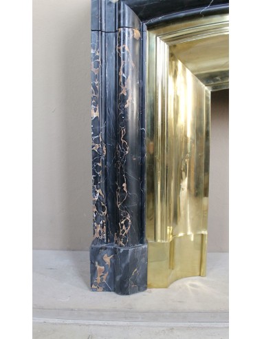 Antique Louis XIV "Boudin" fireplace mantel in exceptional black Portoro marble, complete with its original gilt brass insert.