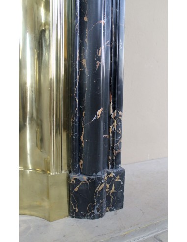 Antique Louis XIV "Boudin" fireplace mantel in exceptional black Portoro marble, complete with its original gilt brass insert.