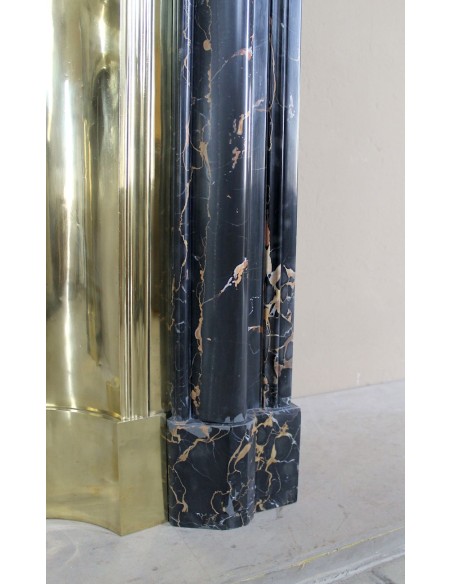 Antique Louis XIV "Boudin" fireplace mantel in exceptional black Portoro marble, complete with its original gilt brass insert.