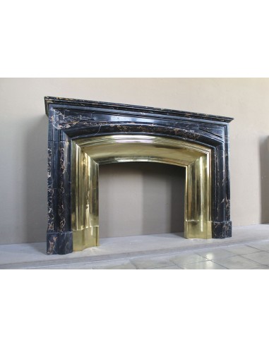 Antique Louis XIV "Boudin" fireplace mantel in exceptional black Portoro marble, complete with its original gilt brass insert.
