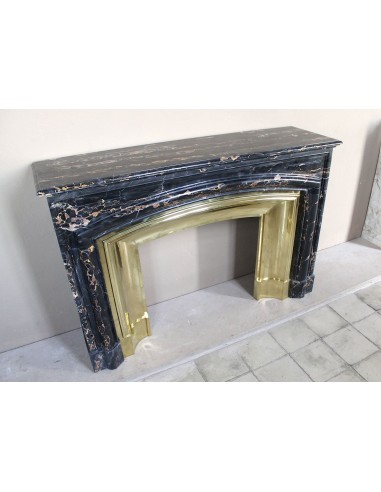 Antique Louis XIV "Boudin" fireplace mantel in exceptional black Portoro marble, complete with its original gilt brass insert.