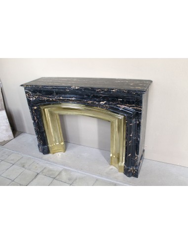 Antique Louis XIV "Boudin" fireplace mantel in exceptional black Portoro marble, complete with its original gilt brass insert.