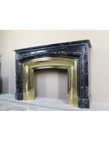 Antique Louis XIV "Boudin" fireplace mantel in exceptional black Portoro marble, complete with its original gilt brass insert.