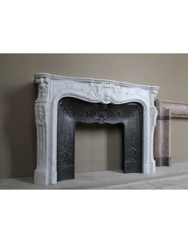 Antique Louis XV fireplace mantel in white marble with elegant floral decorations, with its original artistic cast-iron insert