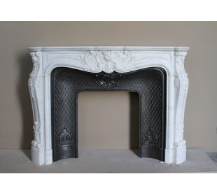 Louis XV “Moustache” fire surround in “Pure White" Carrara marble, complete with cast iron insert featuring floral decorations.