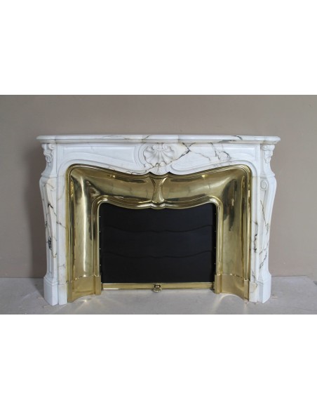 Exceptional Louis XV "Trois Coquilles" fireplace mantel in rare white veined Paonazzetto marble with original gilt brass insert.