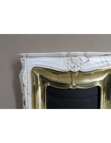 Exceptional Louis XV "Trois Coquilles" fireplace mantel in rare Paonazzetto marble with original gilt brass insert.