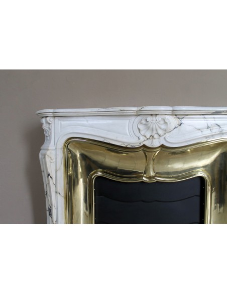 Exceptional Louis XV "Trois Coquilles" fireplace mantel in rare Paonazzetto marble with original gilt brass insert.