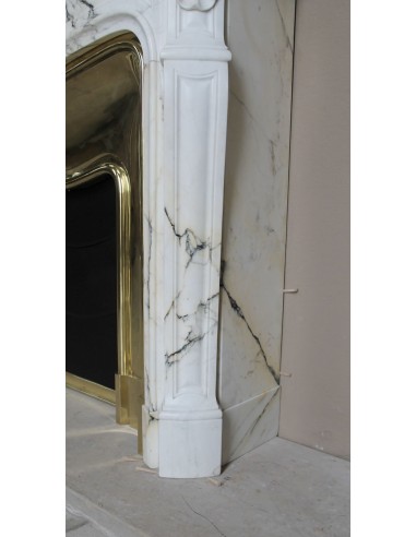 Exceptional Louis XV "Trois Coquilles" fireplace mantel in rare white veined Paonazzetto marble with original gilt brass insert.