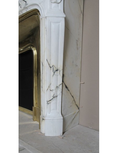 Exceptional Louis XV "Trois Coquilles" fireplace mantel in rare white veined Paonazzetto marble with original gilt brass insert.