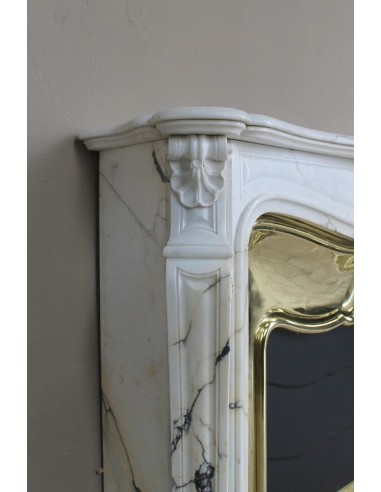 Exceptional Louis XV "Trois Coquilles" fireplace mantel in rare white veined Paonazzetto marble with original gilt brass insert.