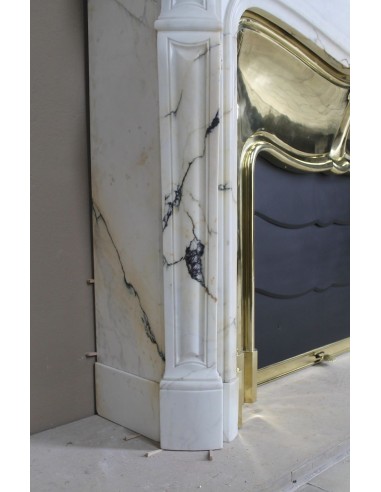 Exceptional Louis XV "Trois Coquilles" fireplace mantel in rare white veined Paonazzetto marble with original gilt brass insert.