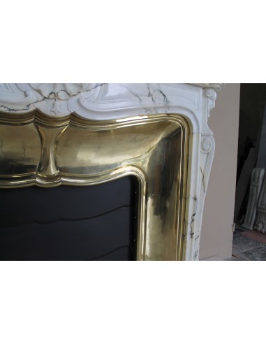 Exceptional Louis XV "Trois Coquilles" fireplace mantel in rare white veined Paonazzetto marble with original gilt brass insert.