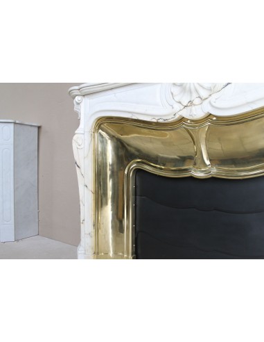 Exceptional Louis XV "Trois Coquilles" fireplace mantel in rare white veined Paonazzetto marble with original gilt brass insert.