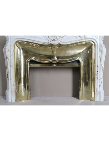 Exceptional Louis XV "Trois Coquilles" fireplace mantel in rare white veined Paonazzetto marble with original gilt brass insert.