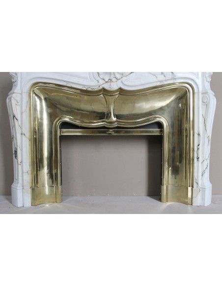 Exceptional Louis XV "Trois Coquilles" fireplace mantel in rare white veined Paonazzetto marble with original gilt brass insert.