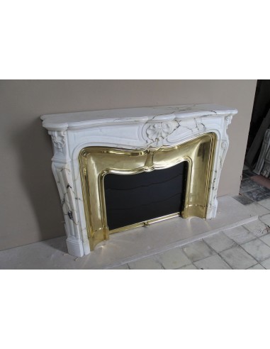Exceptional Louis XV "Trois Coquilles" fireplace mantel in rare white veined Paonazzetto marble with original gilt brass insert.