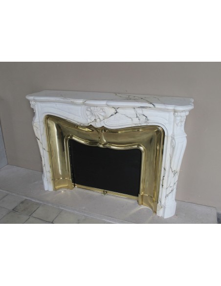 Exceptional Louis XV "Trois Coquilles" fireplace mantel in rare white veined Paonazzetto marble with original gilt brass insert.