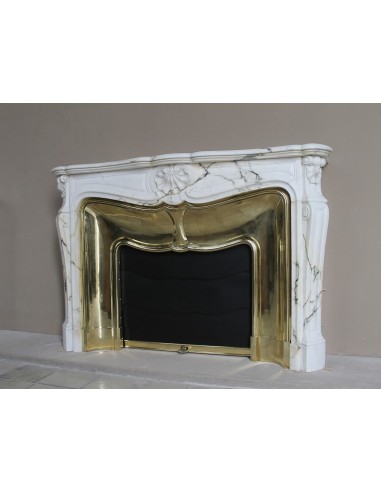 Exceptional Louis XV "Trois Coquilles" fireplace mantel in rare white veined Paonazzetto marble with original gilt brass insert.