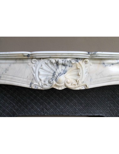 Genuine Baroque fireplace mantel in Calacatta Gold marble with shell carvings, with its original “Tapisserie” cast iron insert.