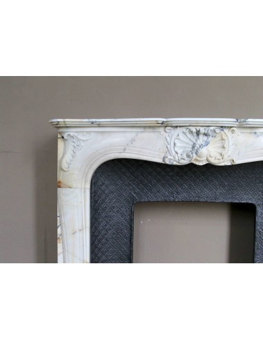 Genuine Baroque fireplace mantel in Calacatta Gold marble with shell carvings, with its original “Tapisserie” cast iron insert.