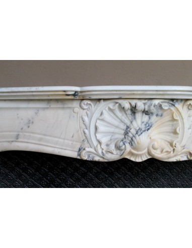 Genuine Baroque fireplace mantel in Calacatta Gold marble with shell carvings, with its original “Tapisserie” cast iron insert.