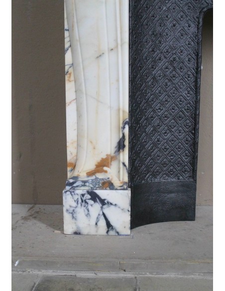 Genuine Baroque fireplace mantel in Calacatta Gold marble with shell carvings, with its original “Tapisserie” cast iron insert.