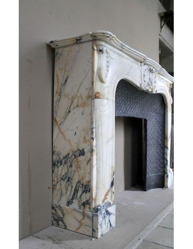 Genuine Baroque fireplace mantel in Calacatta Gold marble with shell carvings, with its original “Tapisserie” cast iron insert.