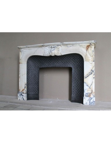 Genuine Baroque fireplace mantel in Calacatta Gold marble with shell carvings, with its original “Tapisserie” cast iron insert.