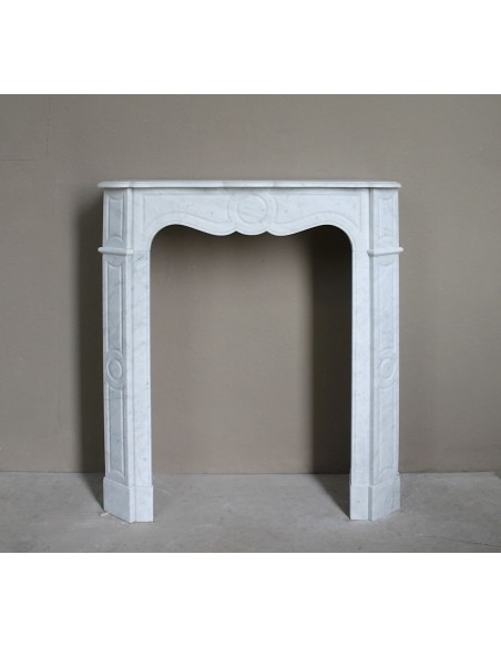 Very small and charming antique Pompadour Plat fireplace mantel carved in white Carrara marble.