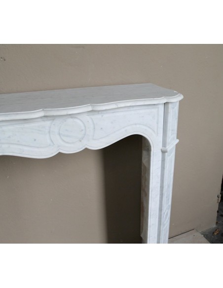 Very small and charming antique Pompadour Plat fireplace mantel carved in white Carrara marble.