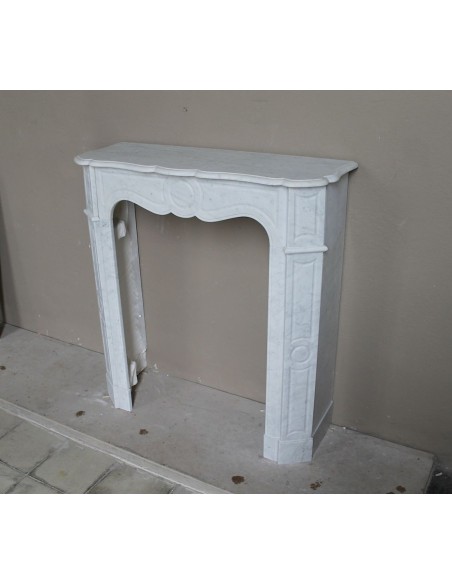 Very small and charming antique Pompadour Plat fireplace mantel carved in white Carrara marble.