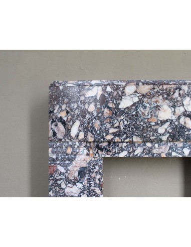 Antique Art Deco fireplace mantel in variegated Africano marble. This marble fireplace surround is genuine, hand-carved.