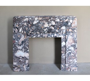 Antique Art Deco fireplace mantel in variegated Africano marble. This marble fireplace surround is genuine, hand-carved.