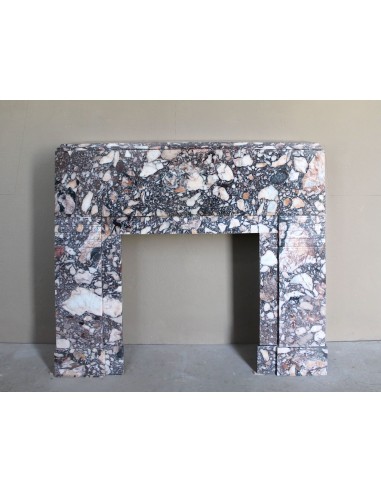Antique Art Deco fireplace mantel in variegated Africano marble. This marble fireplace surround is genuine, hand-carved.