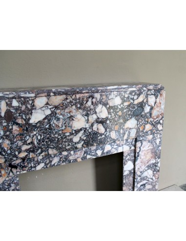 Antique Art Deco fireplace mantel in variegated Africano marble. This marble fireplace surround is genuine, hand-carved.