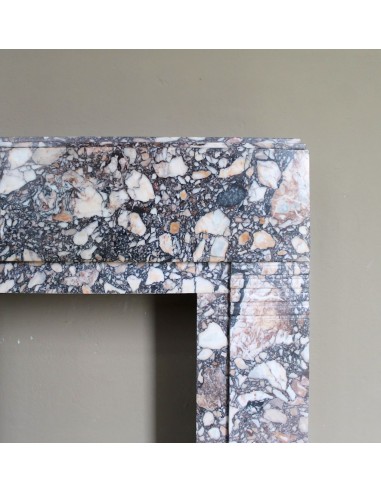 Antique Art Deco fireplace mantel in variegated Africano marble. This marble fireplace surround is genuine, hand-carved.