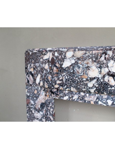 Antique Art Deco fireplace mantel in variegated Africano marble. This marble fireplace surround is genuine, hand-carved.